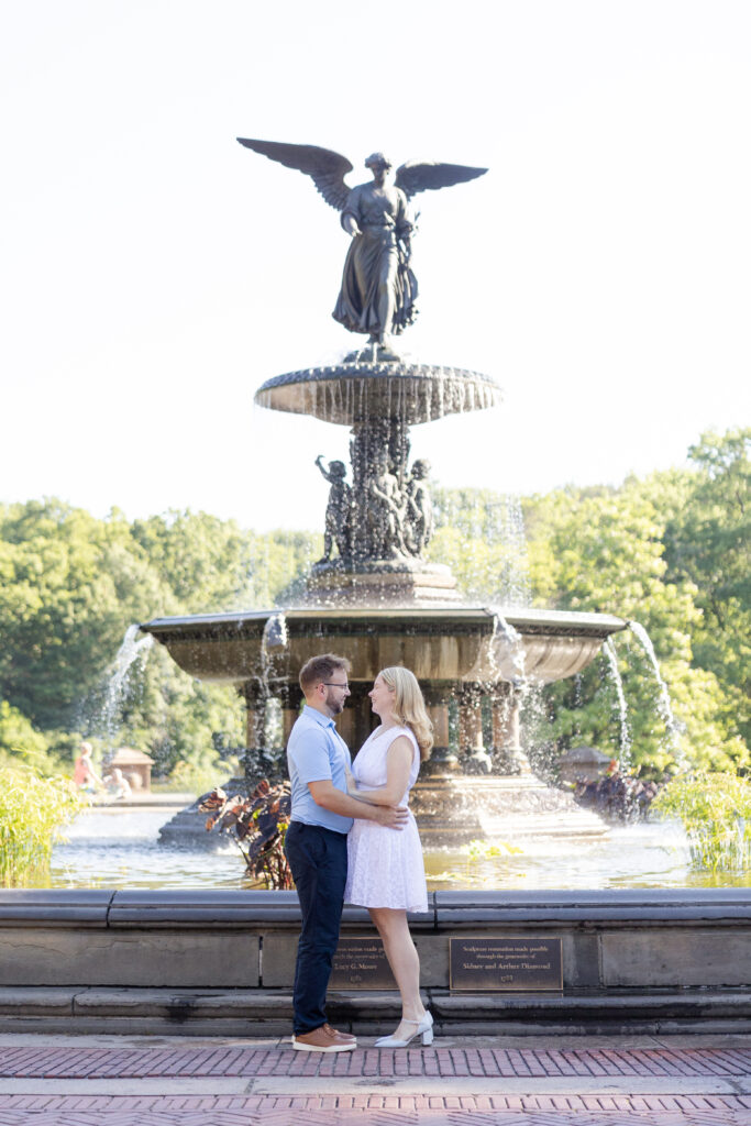 Romantic engagement photos in front of Bethesda Fountain