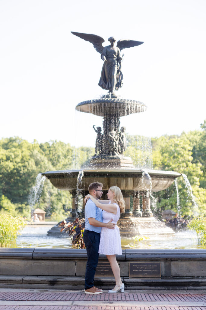 Romantic couple photos in front of Bethesda Fountain