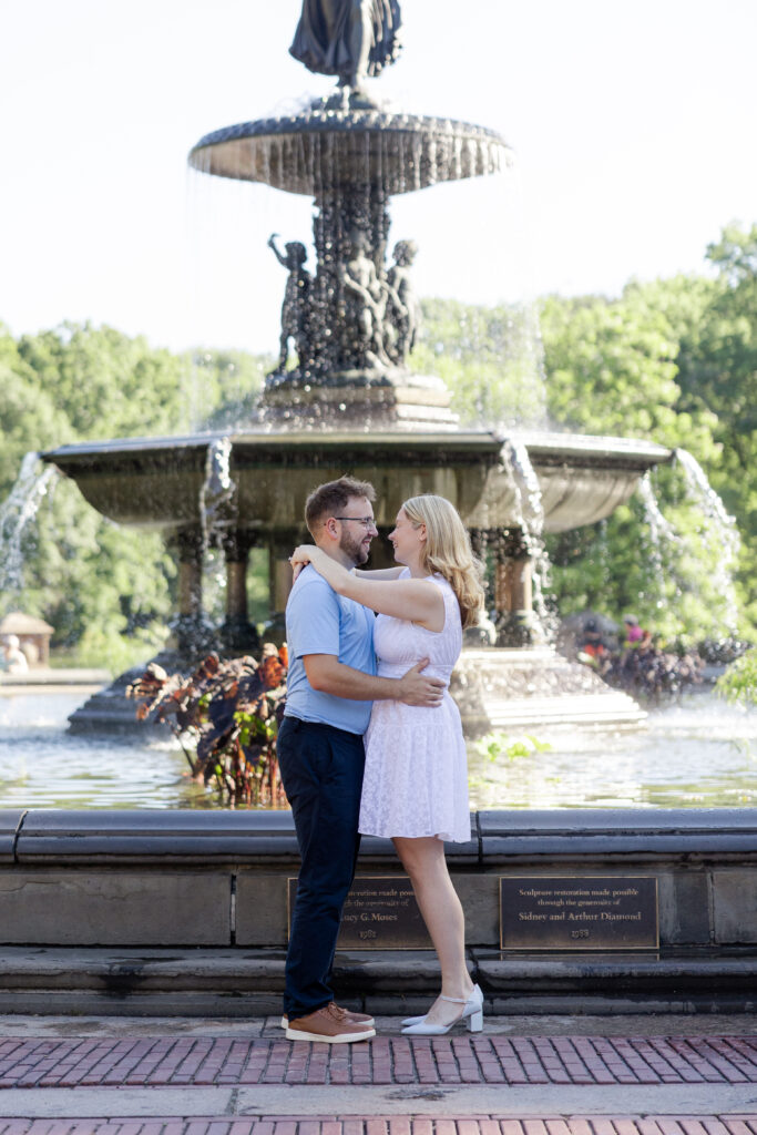 Romantic couple photos in front of Bethesda Fountain