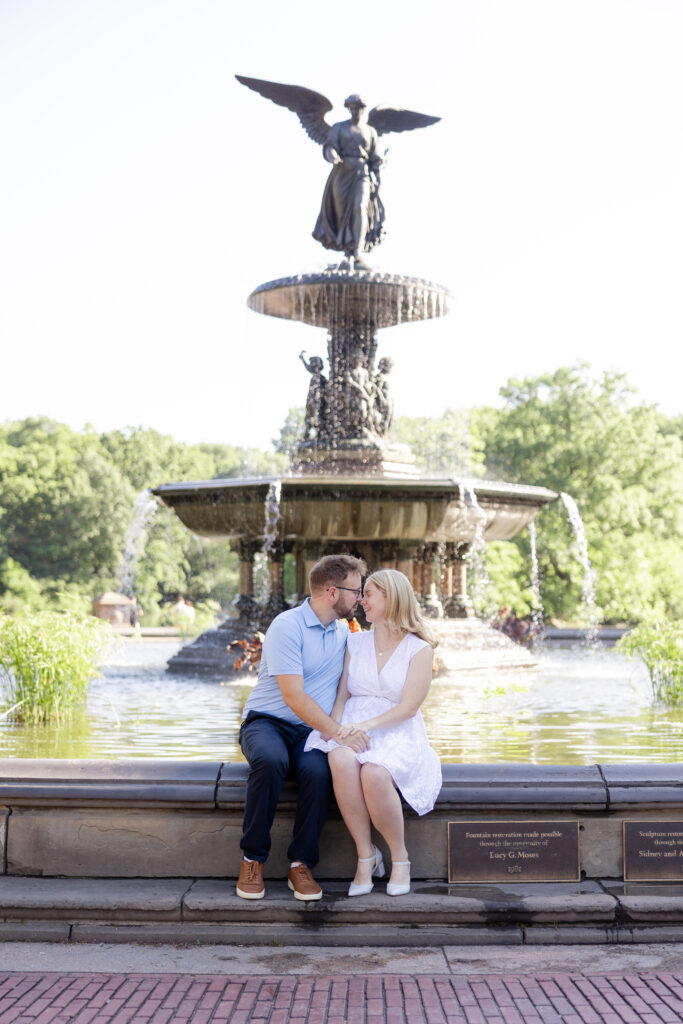 Couple photos in front of Bethesda Fountain