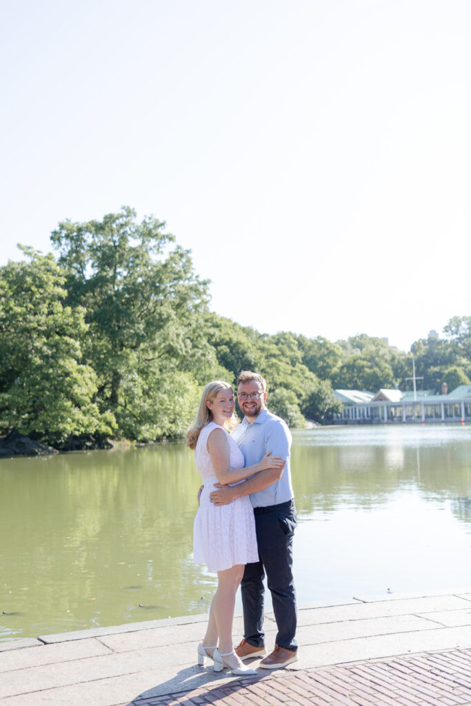 Couple photos in front of Central Park Boathouse