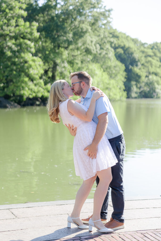 Couple photos in front of Central Park Boathouse