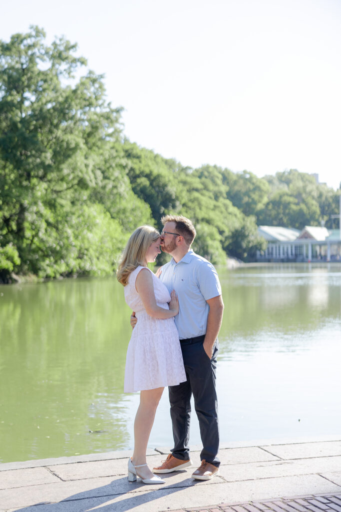 Couple photos in front of Central Park Boathouse