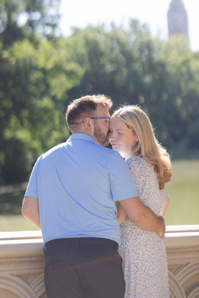 Couple photos on Central Park Bow Bridge