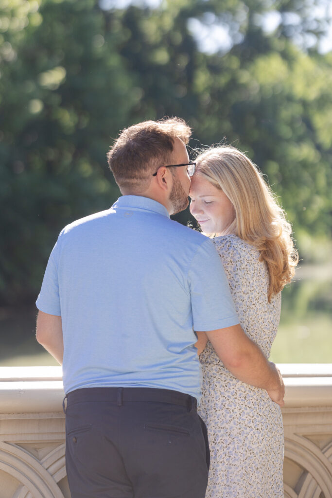 Couple photos on Central Park Bow Bridge