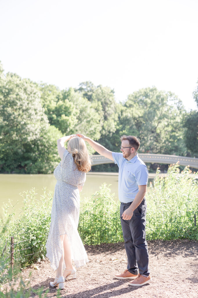 Central Park couple photos in front of Bow Bridge