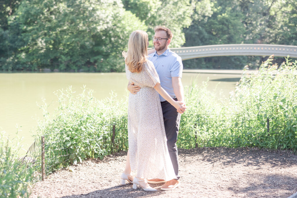 Central Park couple photos in front of Bow Bridge