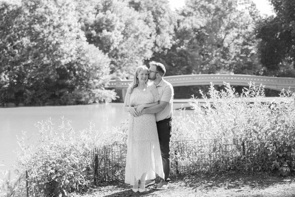 Black and white Central Park couple photos in front of Bow Bridge