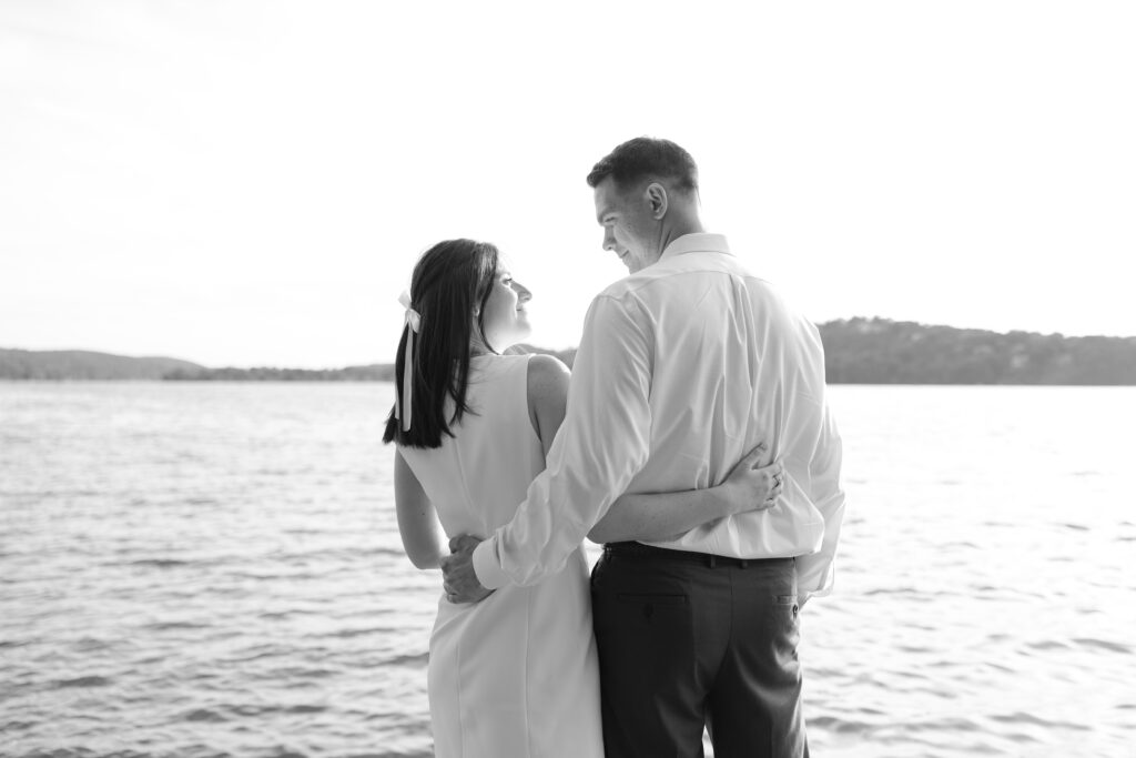 Black and white couple photos in front of Lake Mohawk