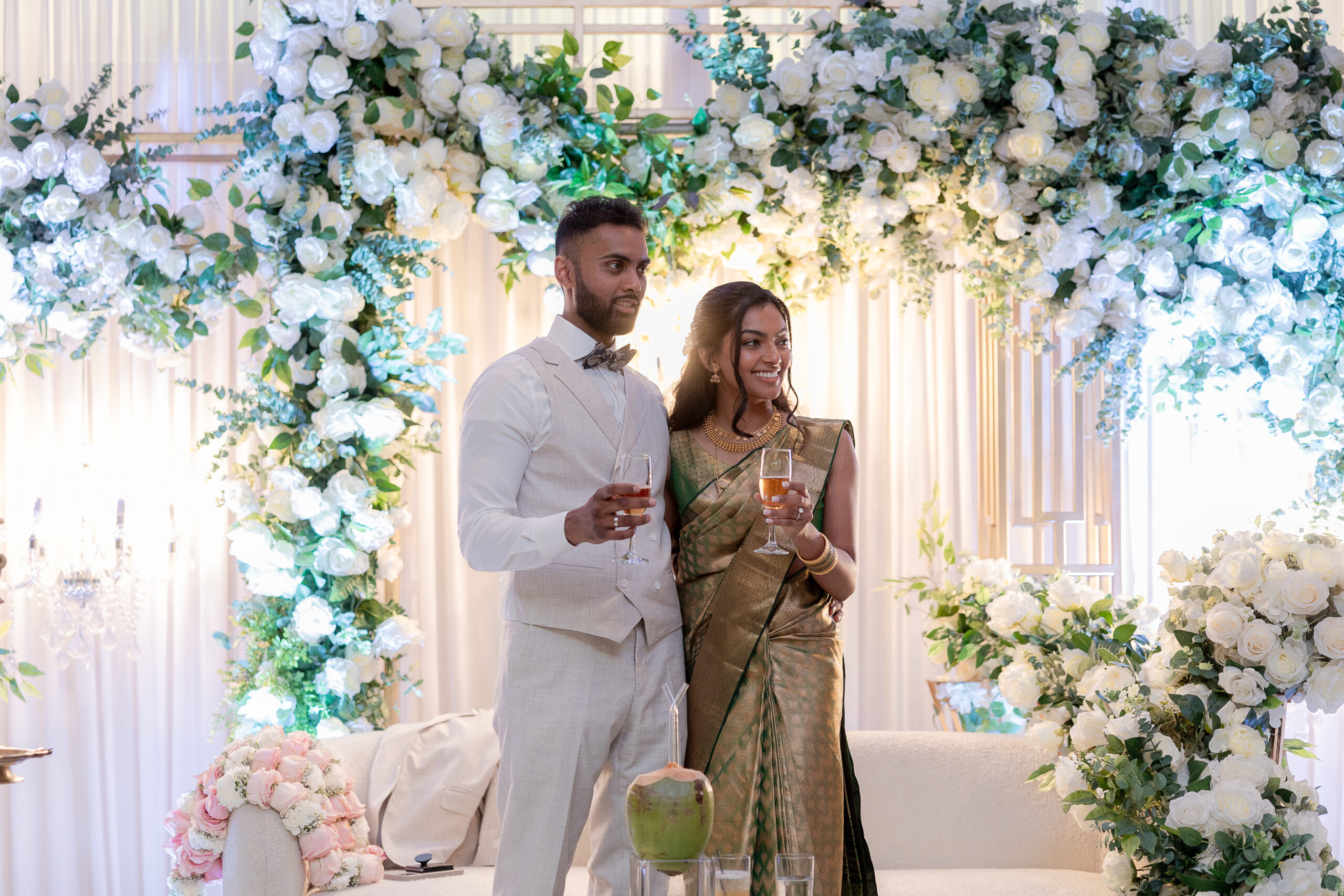 Bride and groom cheers at wedding reception