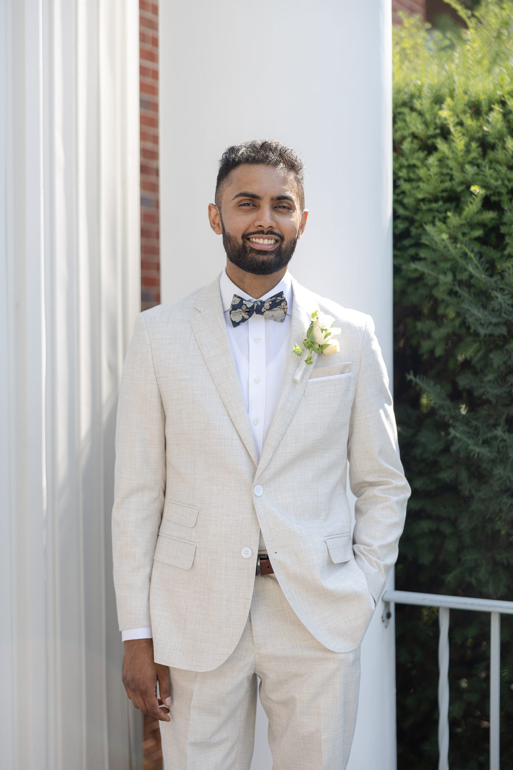 Groom in white wedding suit
