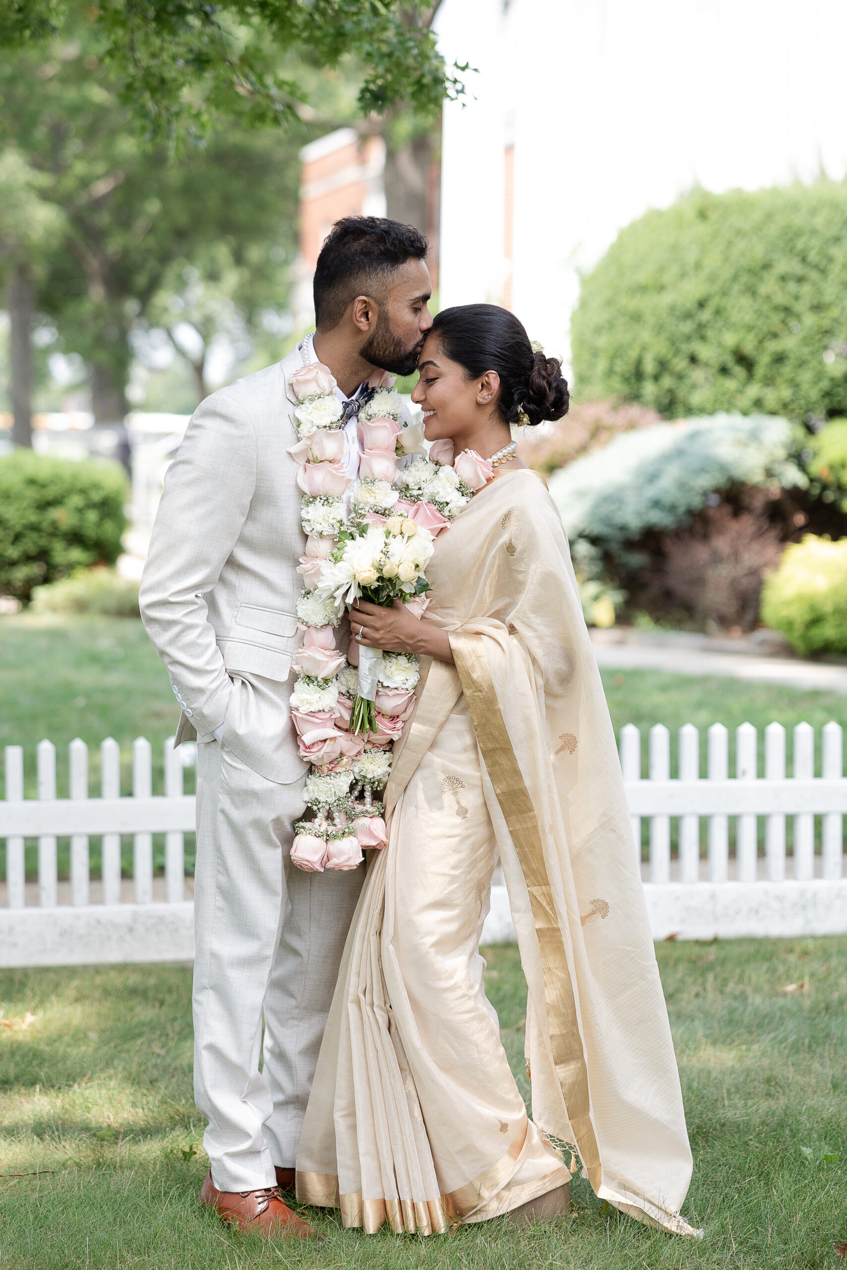 Outdoor bride and groom photos after Indian wedding ceremony