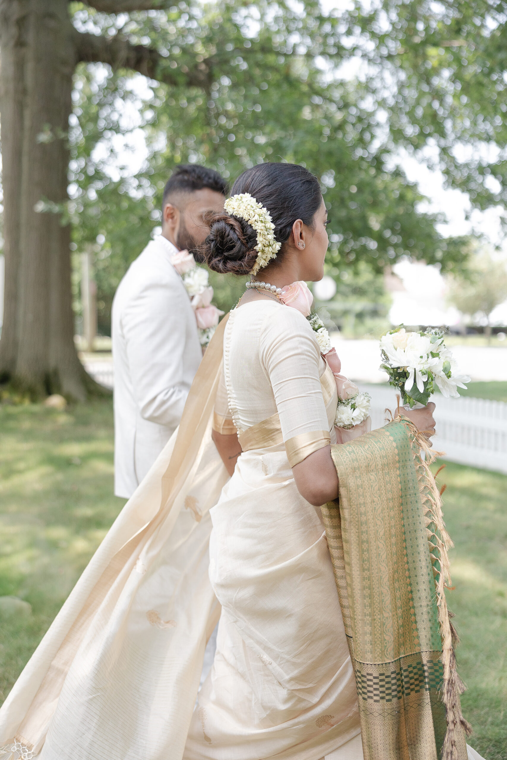 Outdoor bride and groom photos after Indian wedding ceremony