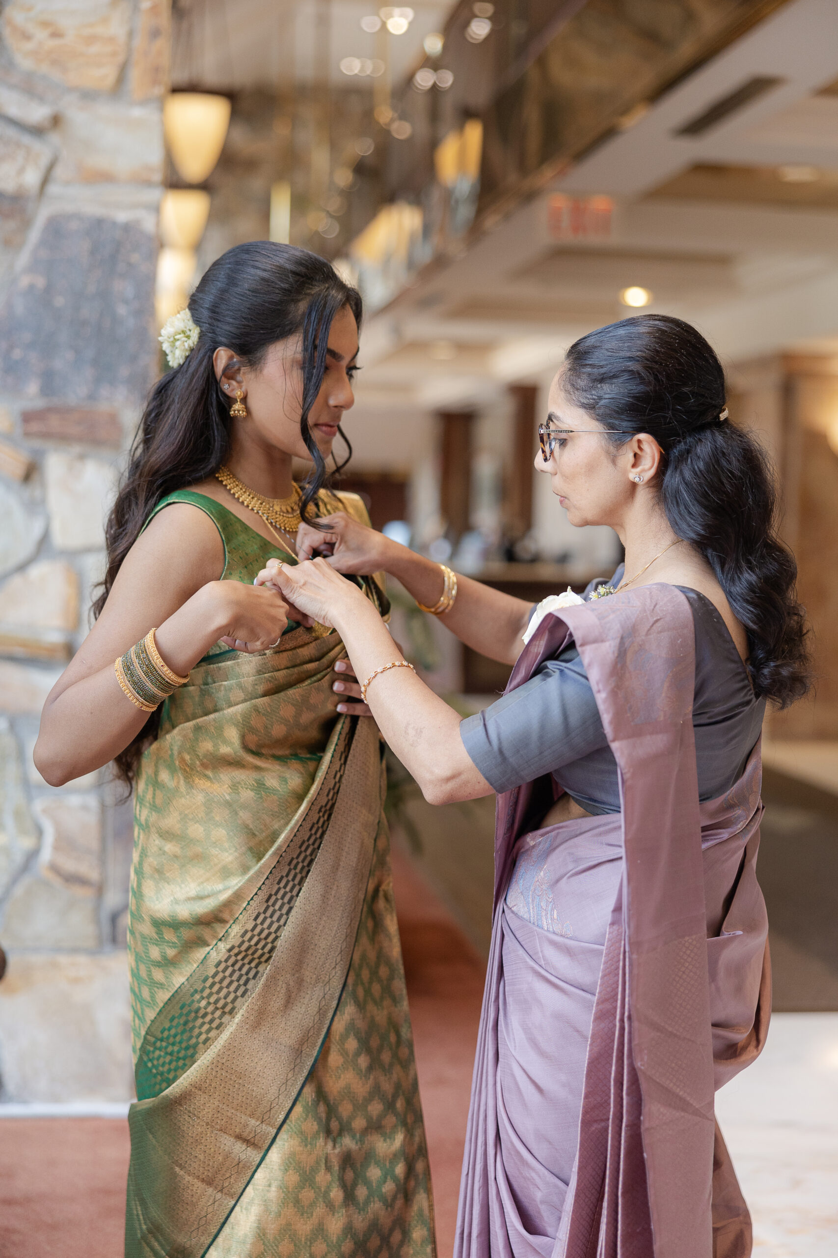 Bride and mom getting ready with Indian green saree