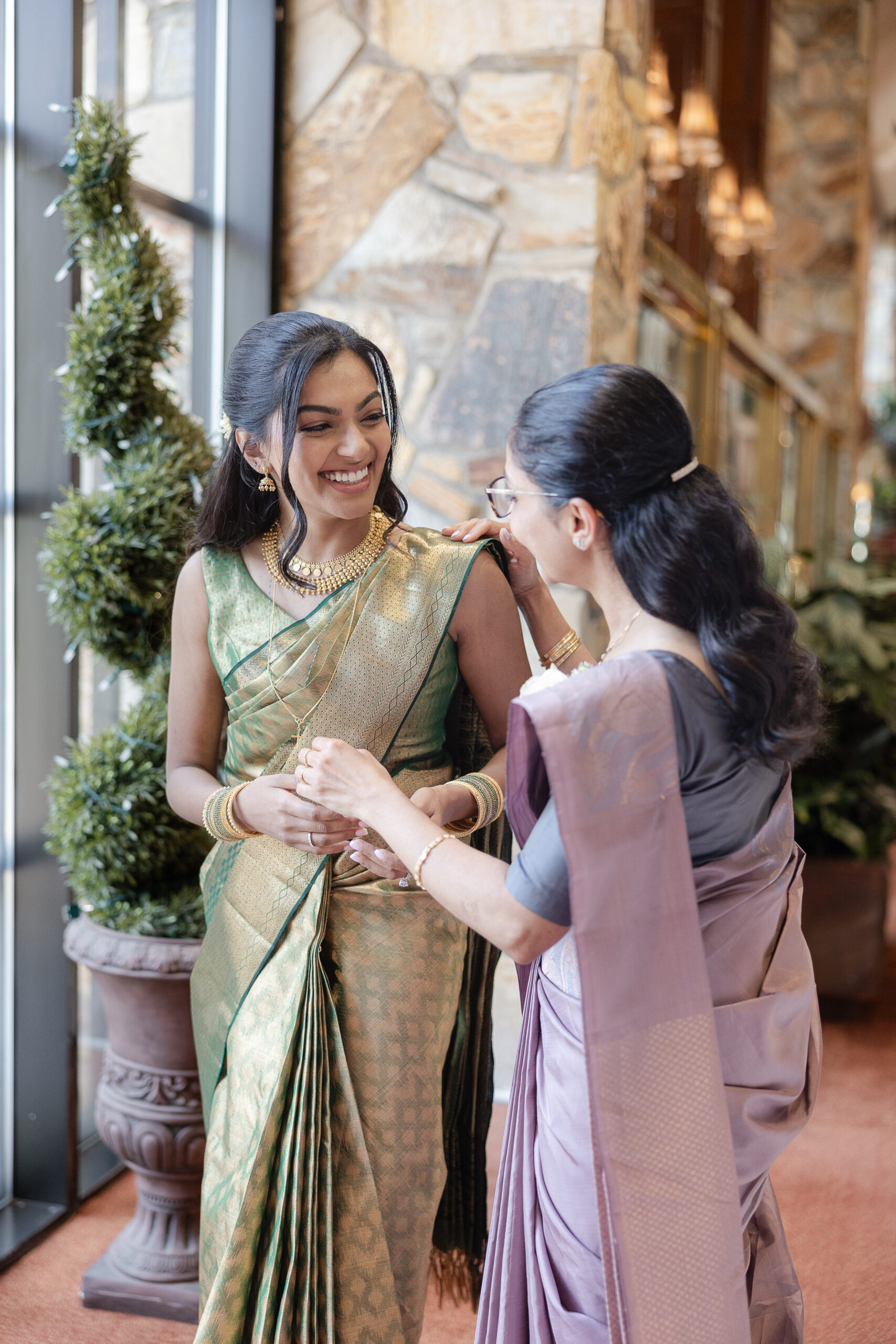 Bride and mom getting ready with Indian green saree