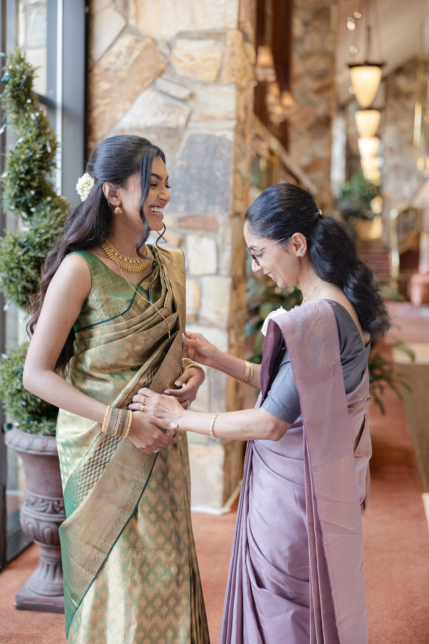 Bride and mom getting ready with Indian green saree