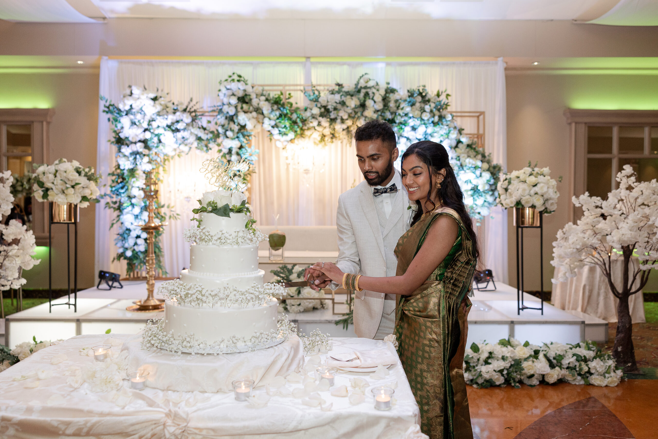 Bride and groom cutting cake