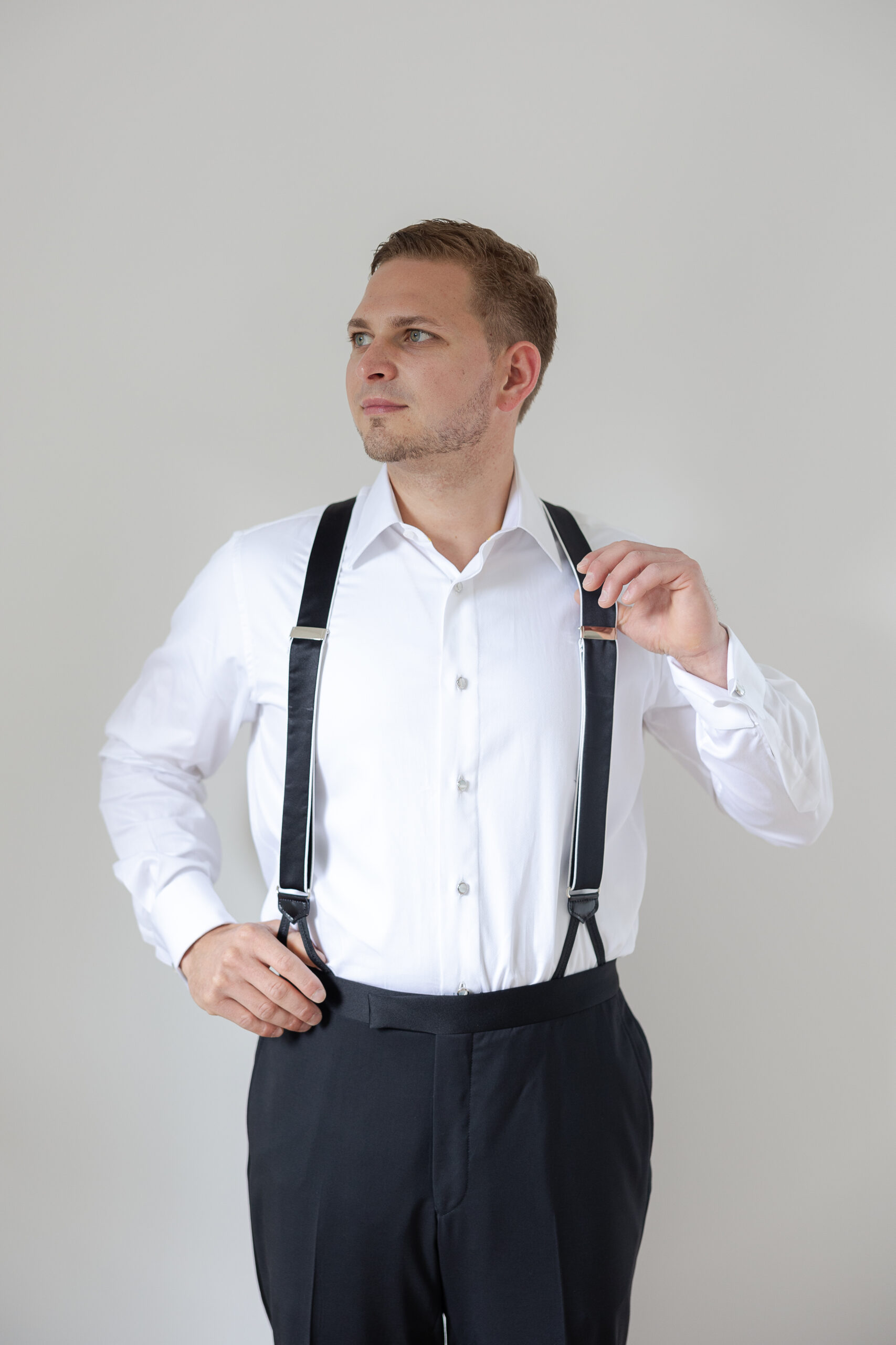 Groom getting dressed for New York Wedding day