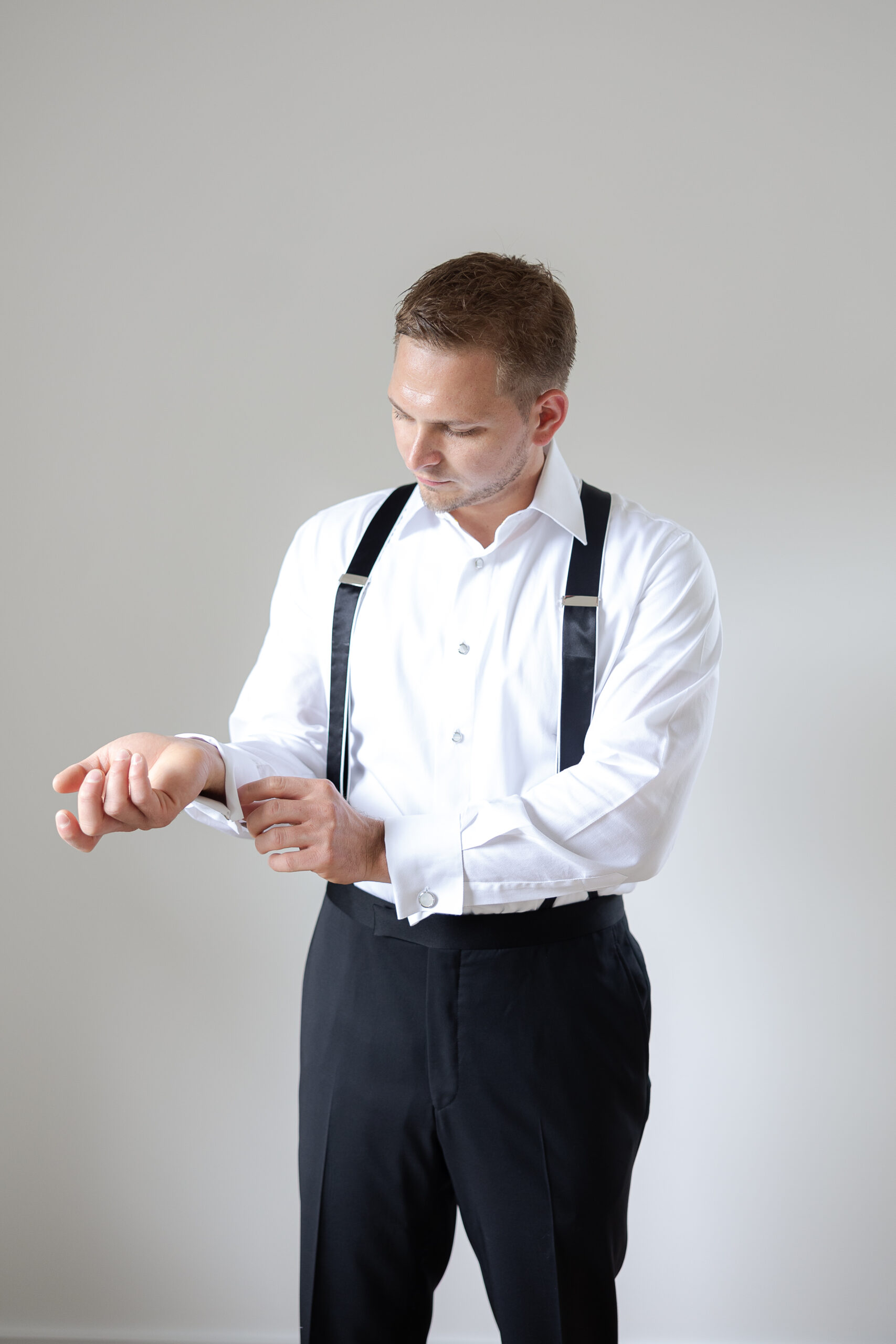 Groom getting dressed for New York Wedding day