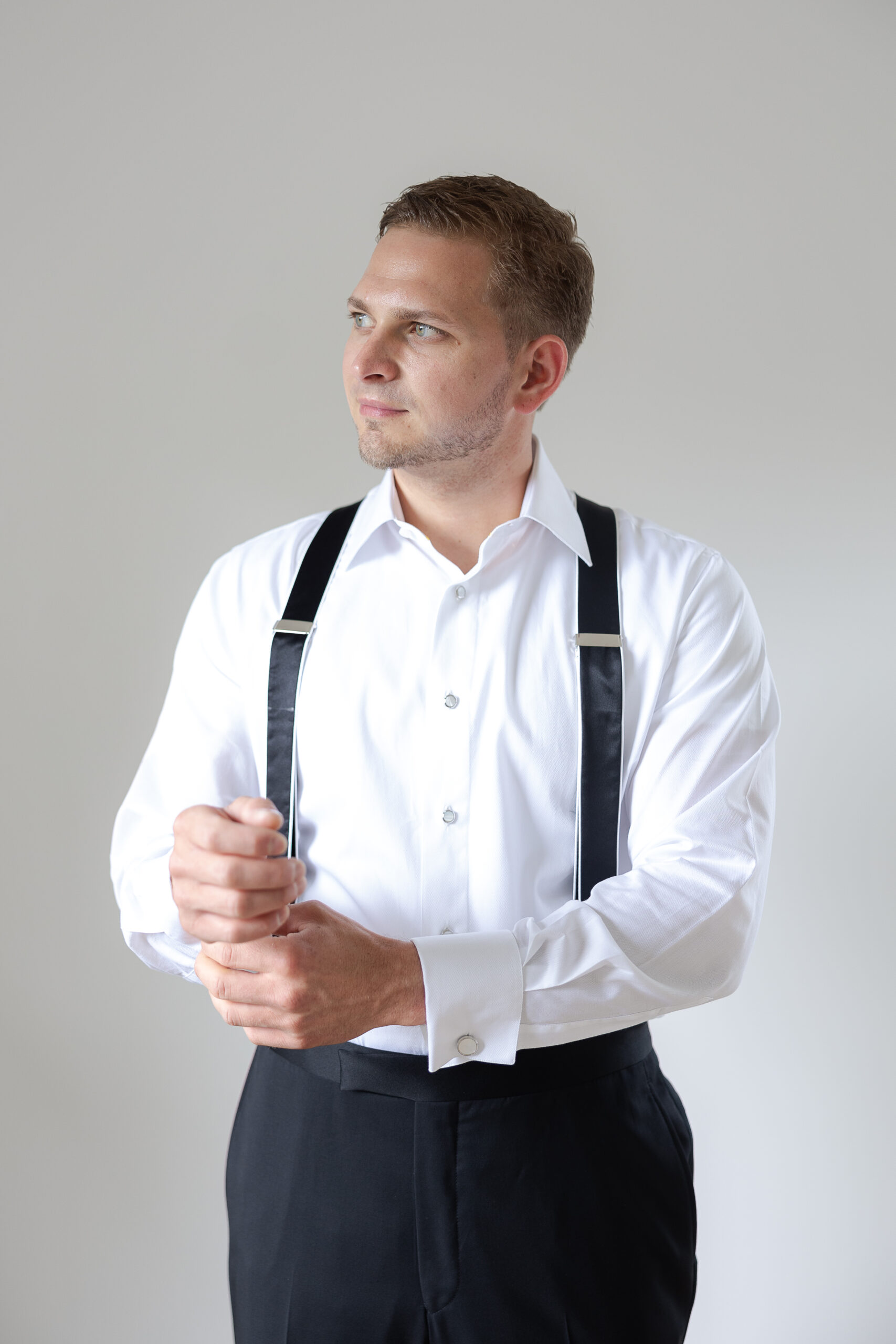Groom getting dressed for New York Wedding day