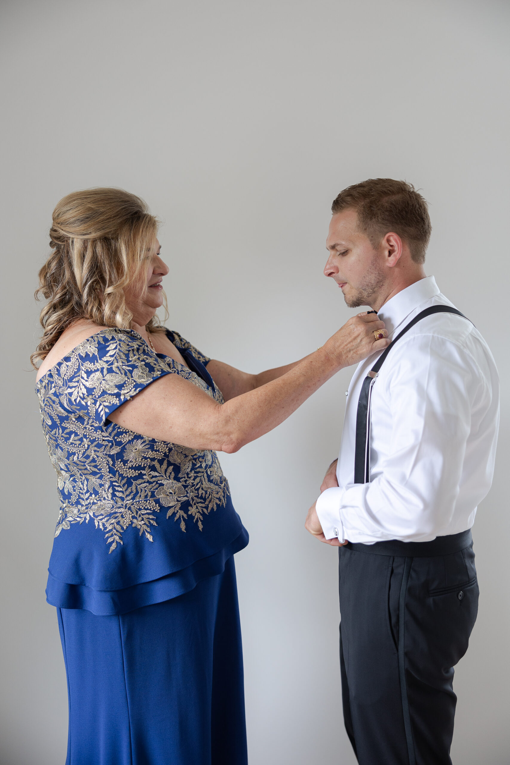 Groom getting dressed for New York Wedding day