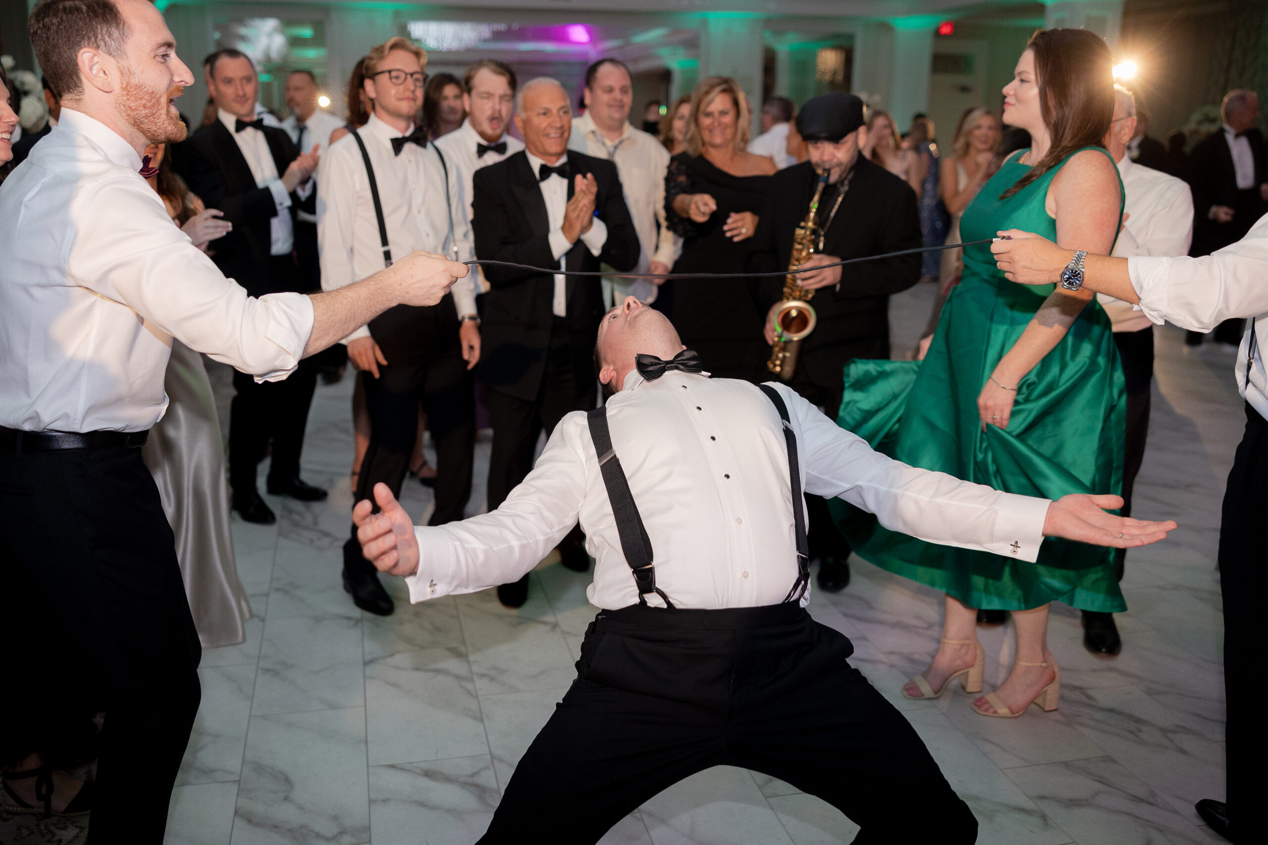 Groom dancing at wedding reception