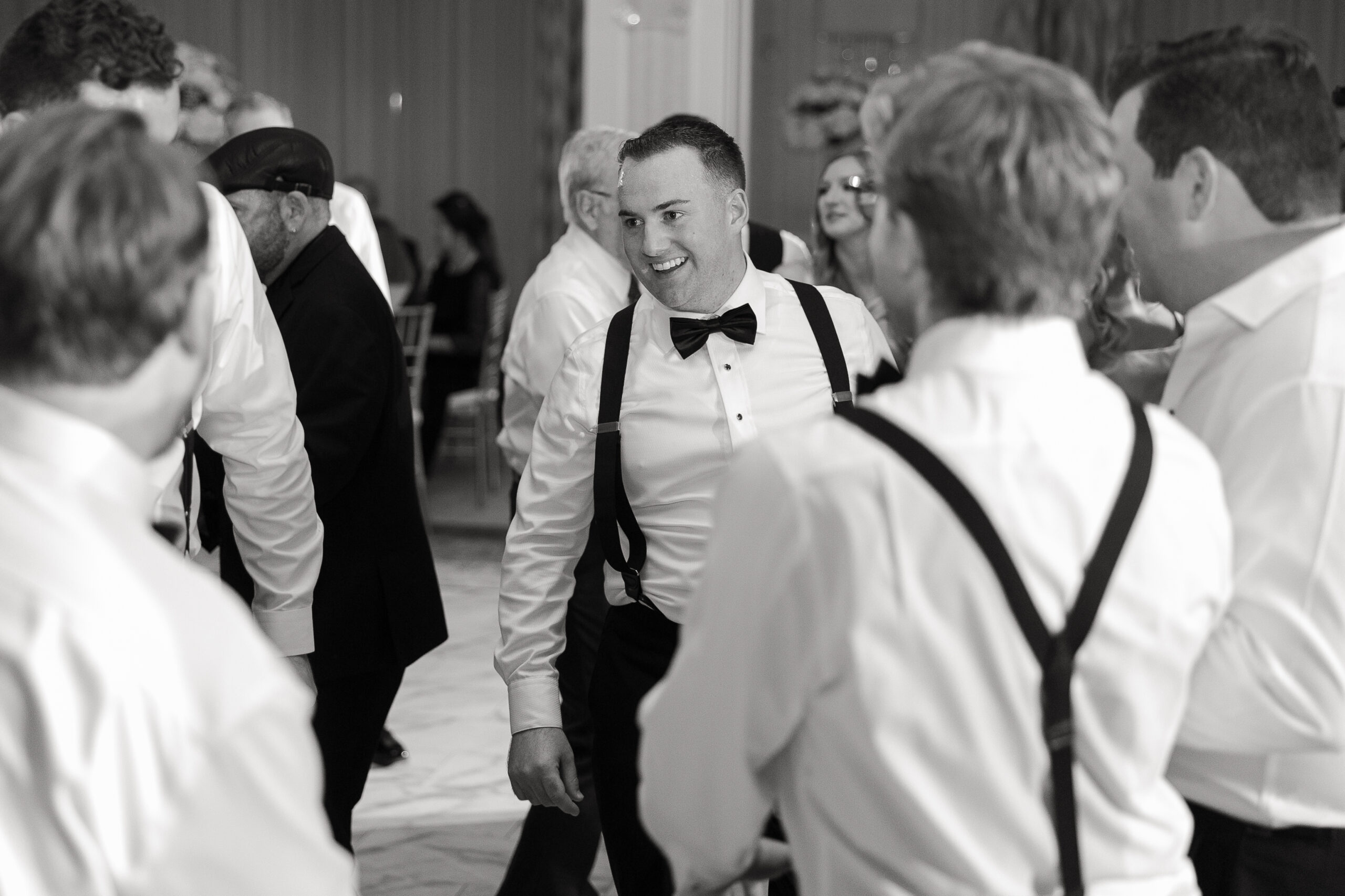 Groom dancing at wedding reception