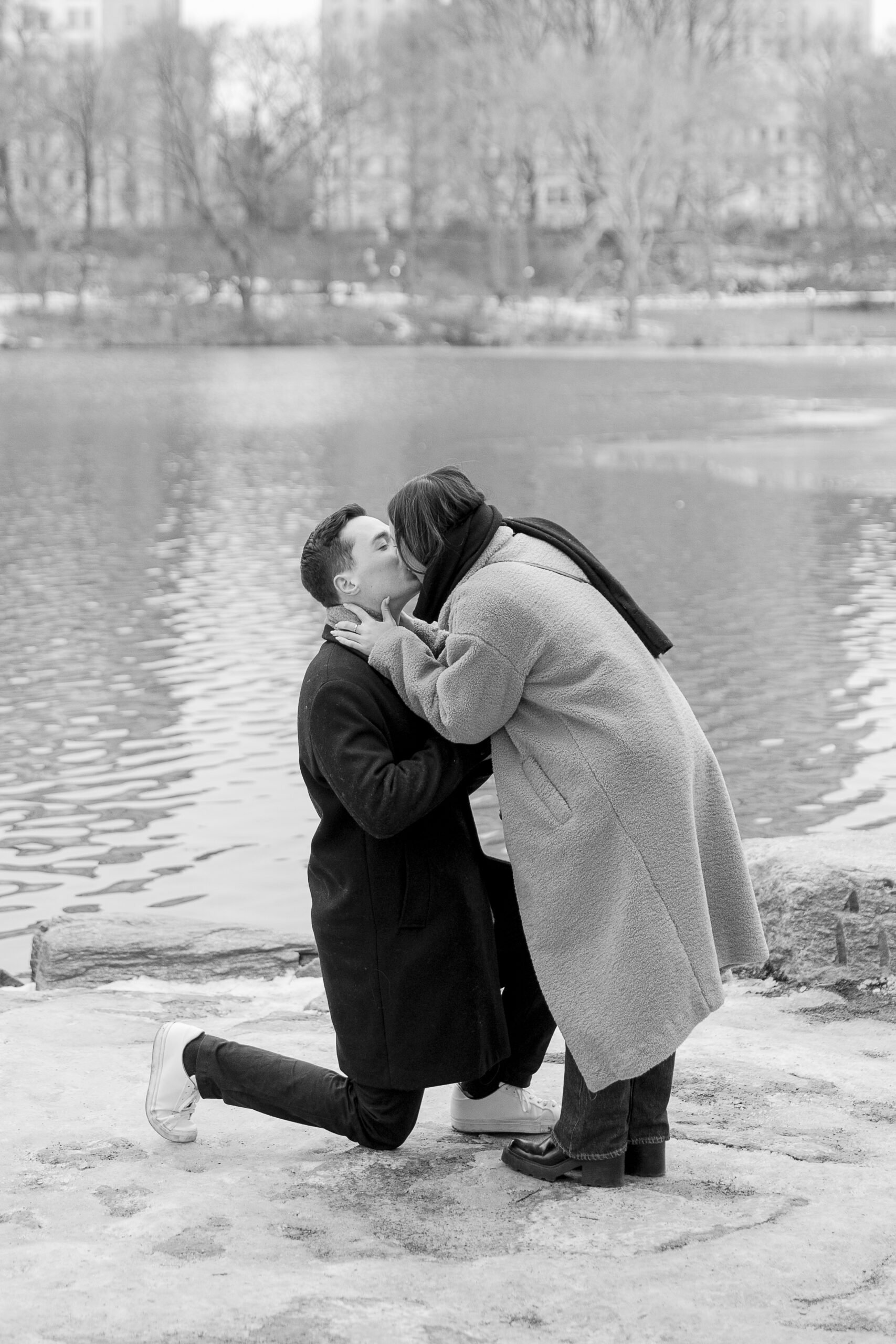 Black and white photo of Central Park proposal with him on his knees