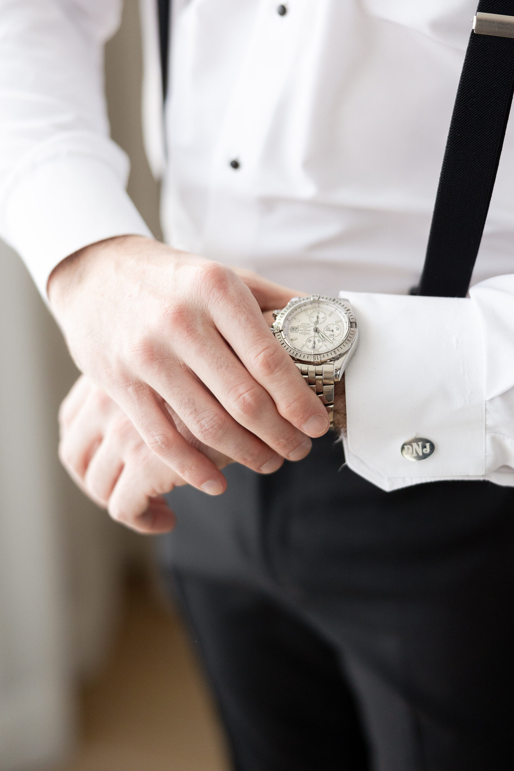 Groom watch wedding details