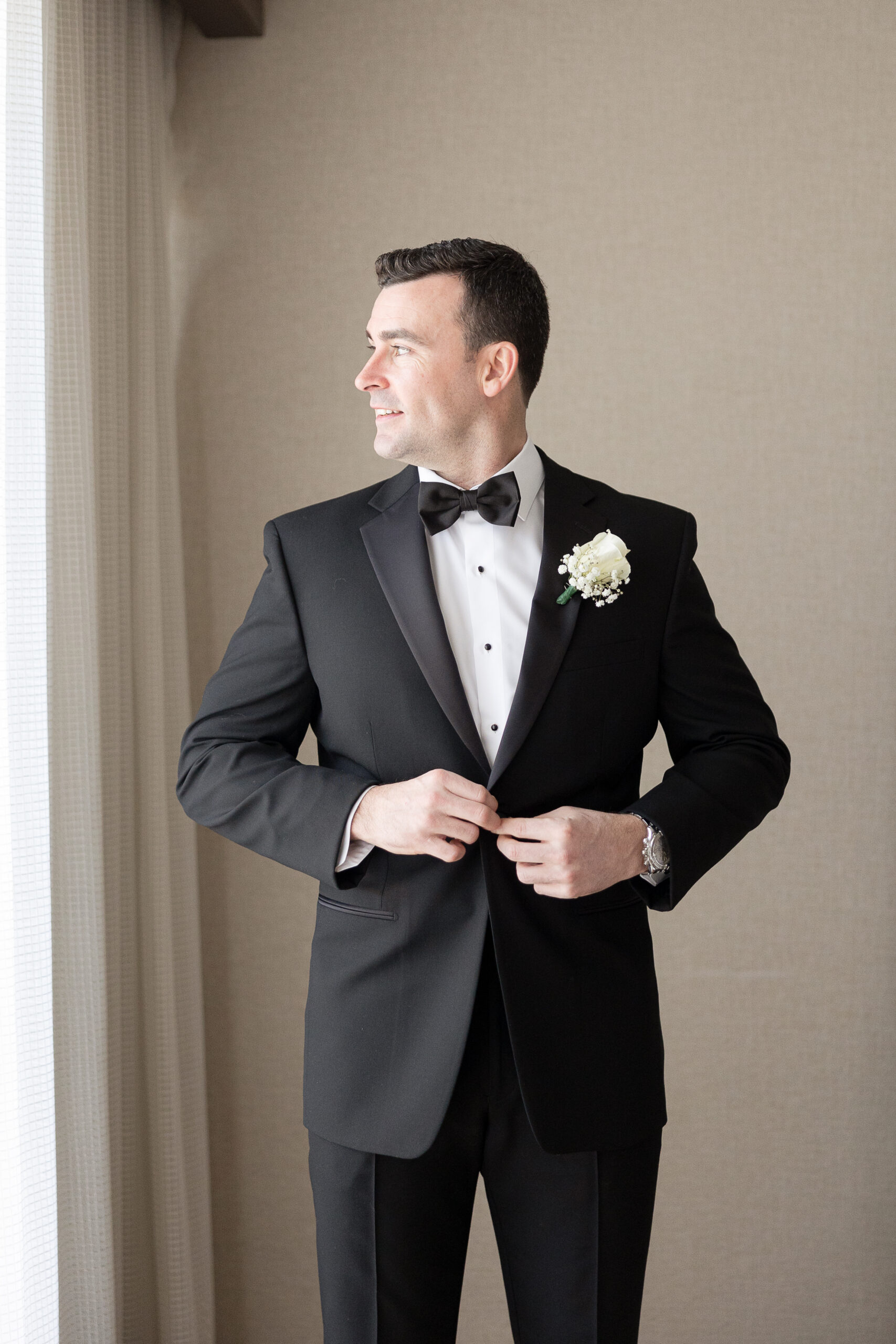 J House Greenwich Groom getting dressed with tux