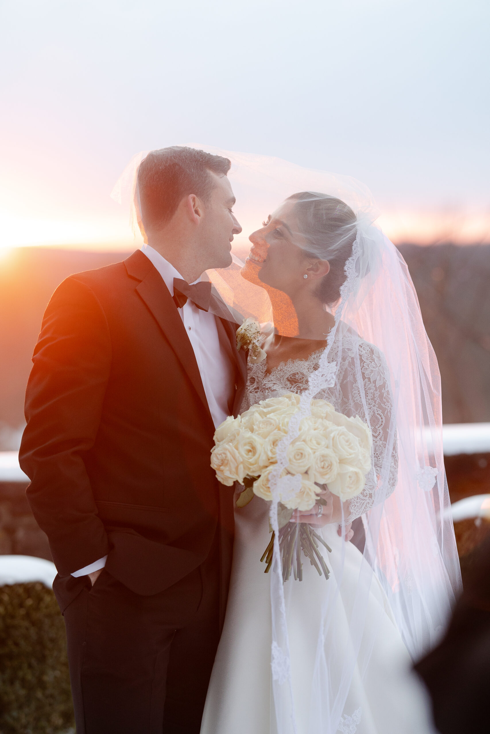 Bride and groom veil moment