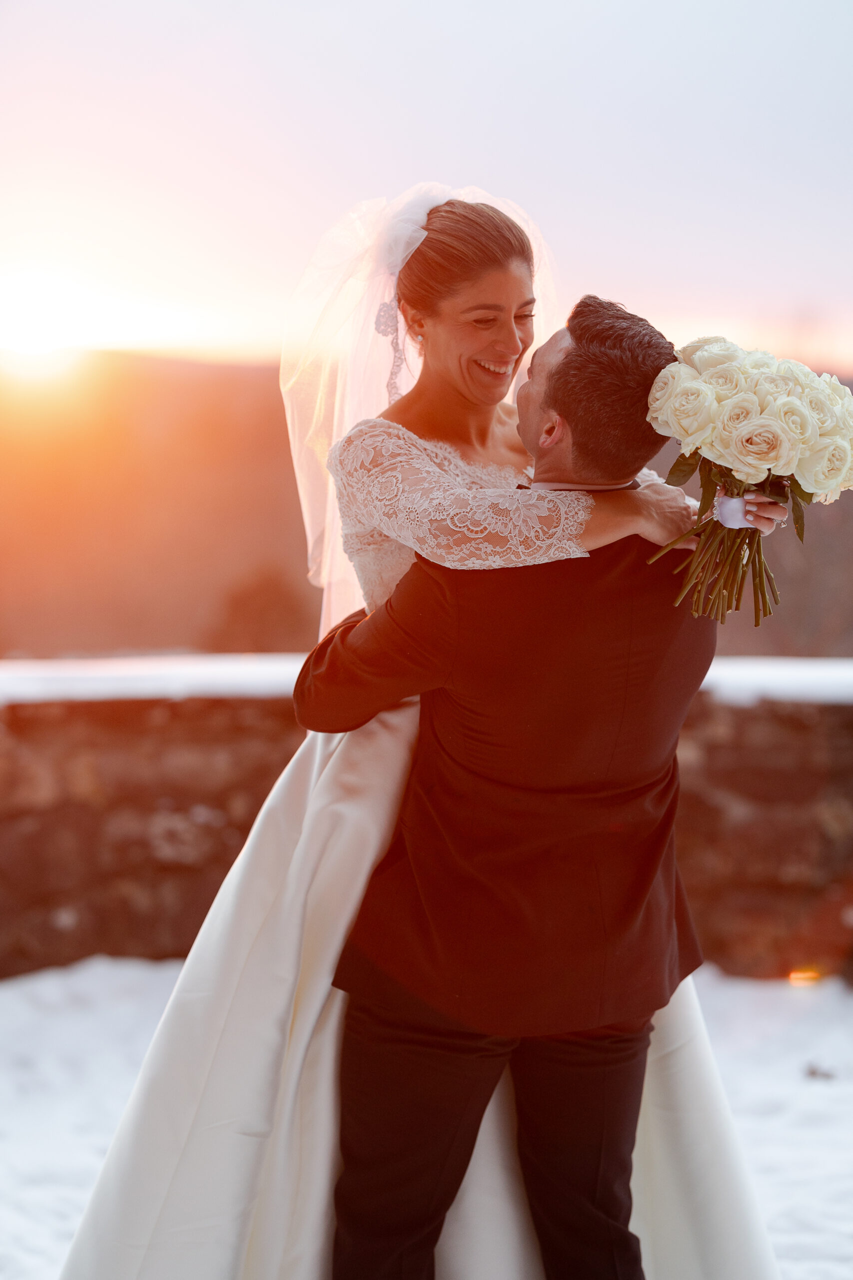 Bride and groom winter portraits with sunset