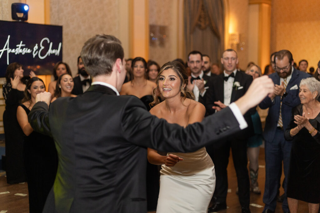 Bride and groom Greek dance at NJ wedding venue