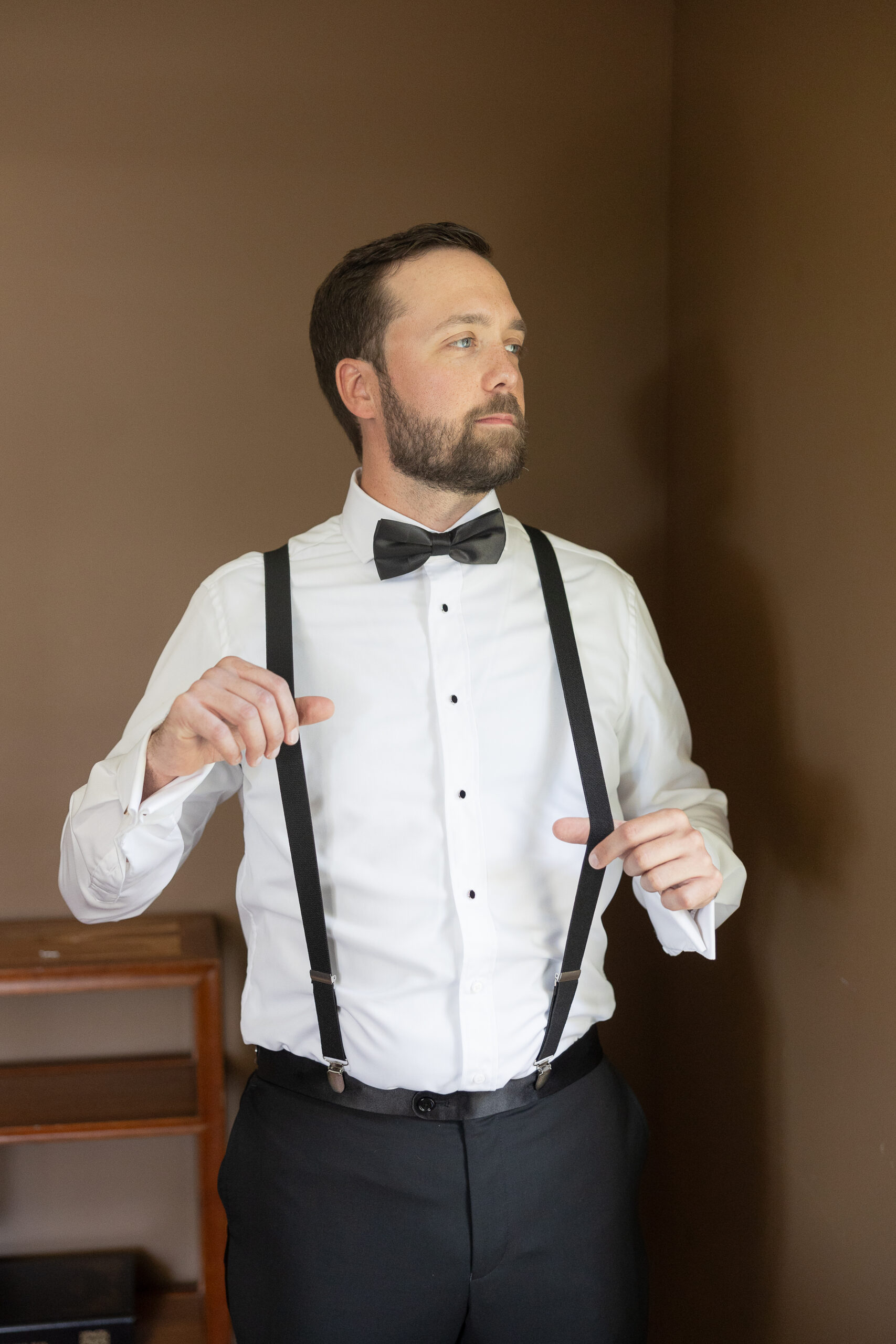 Groom Getting Ready at the Cottage