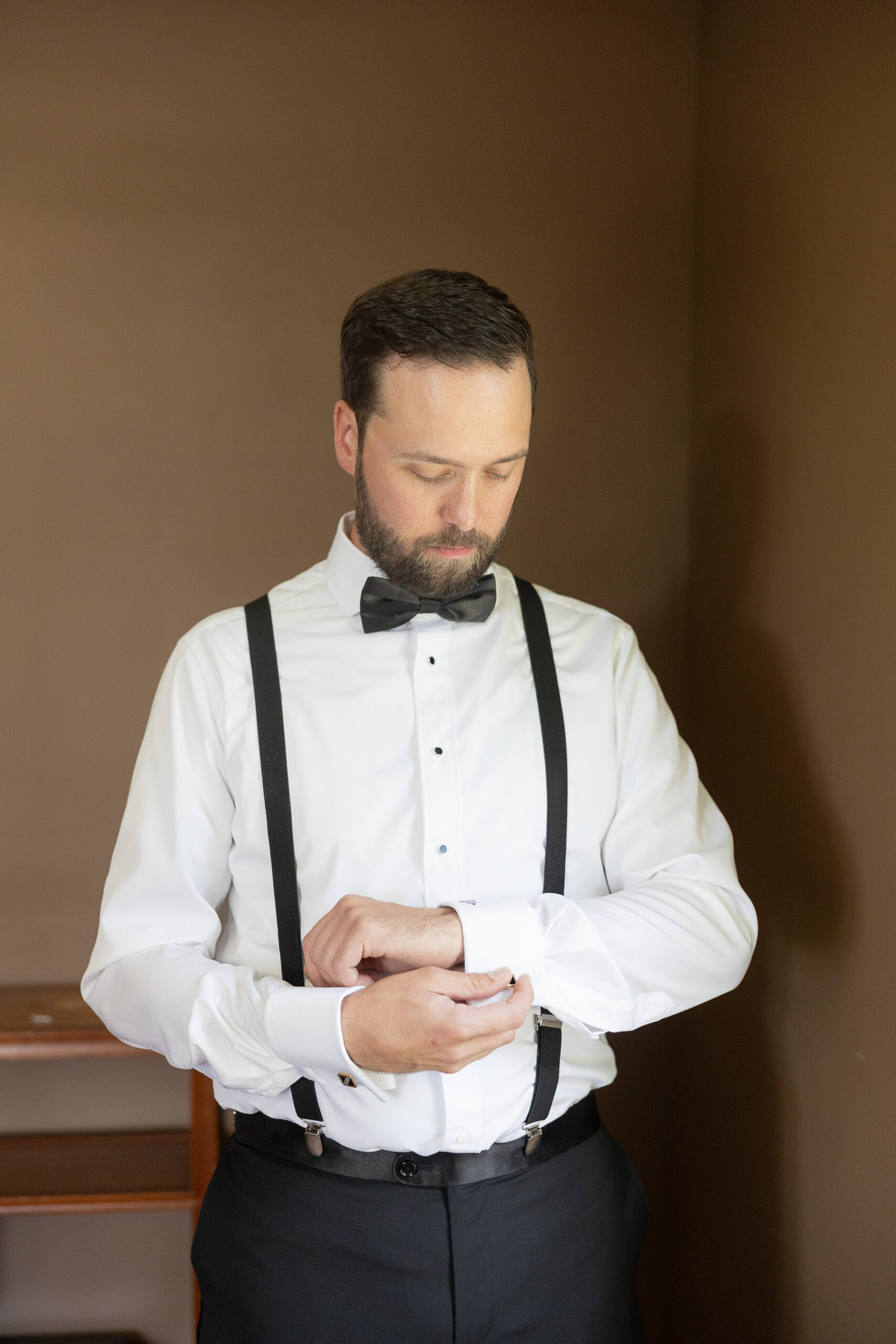 Groom Getting Ready at the Cottage