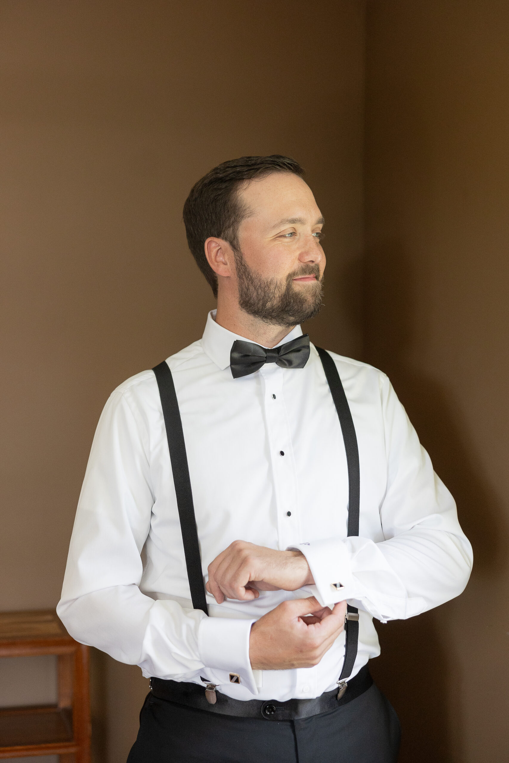 Groom Getting Ready at the Cottage