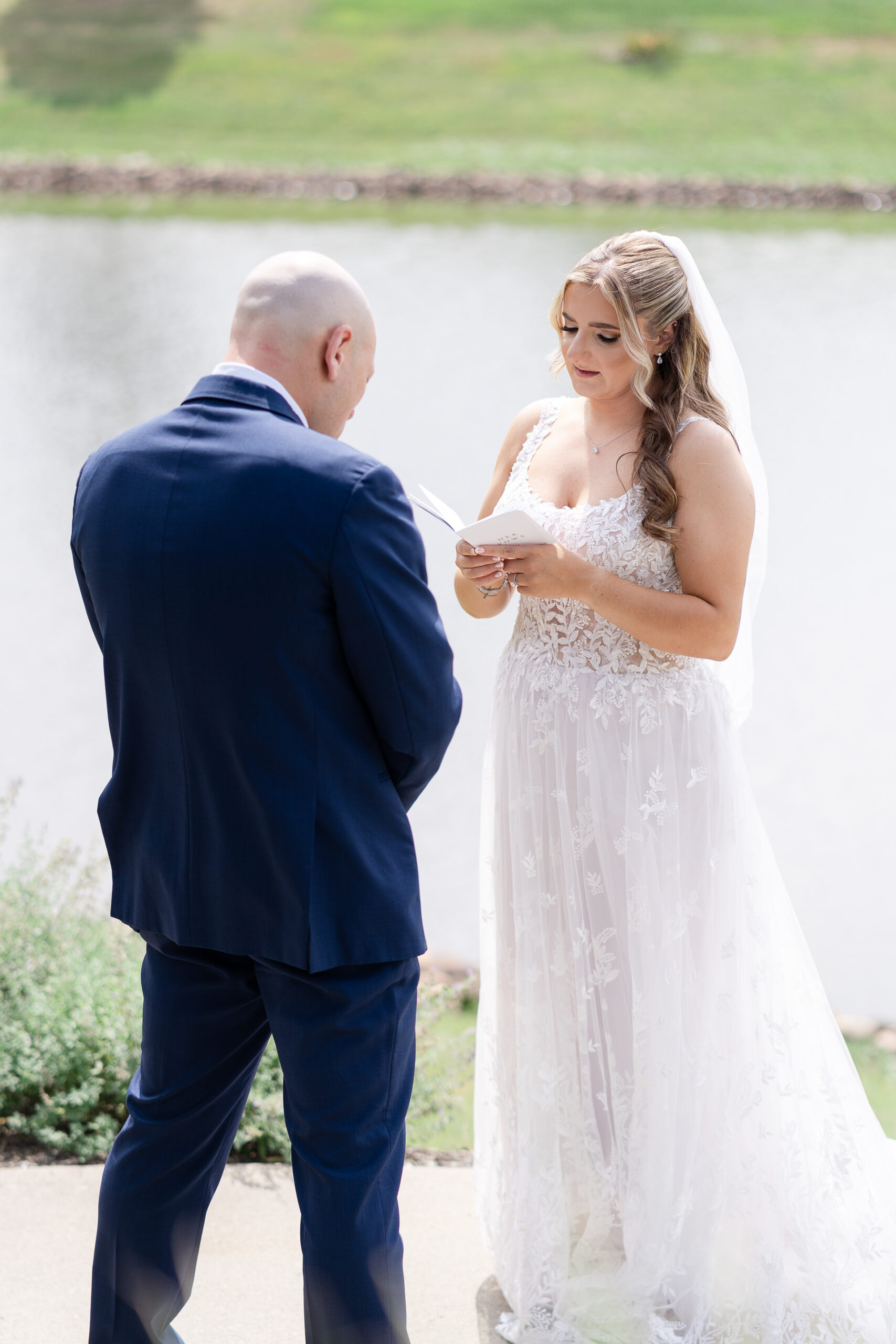 Bride reading private vows to groom