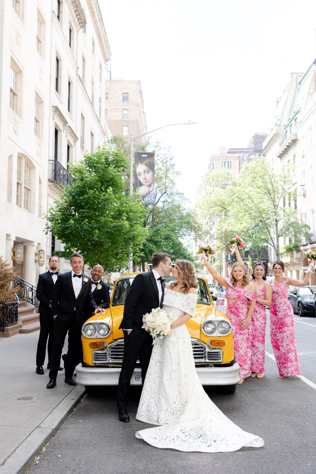 Wedding party in front of checker cab in NYC