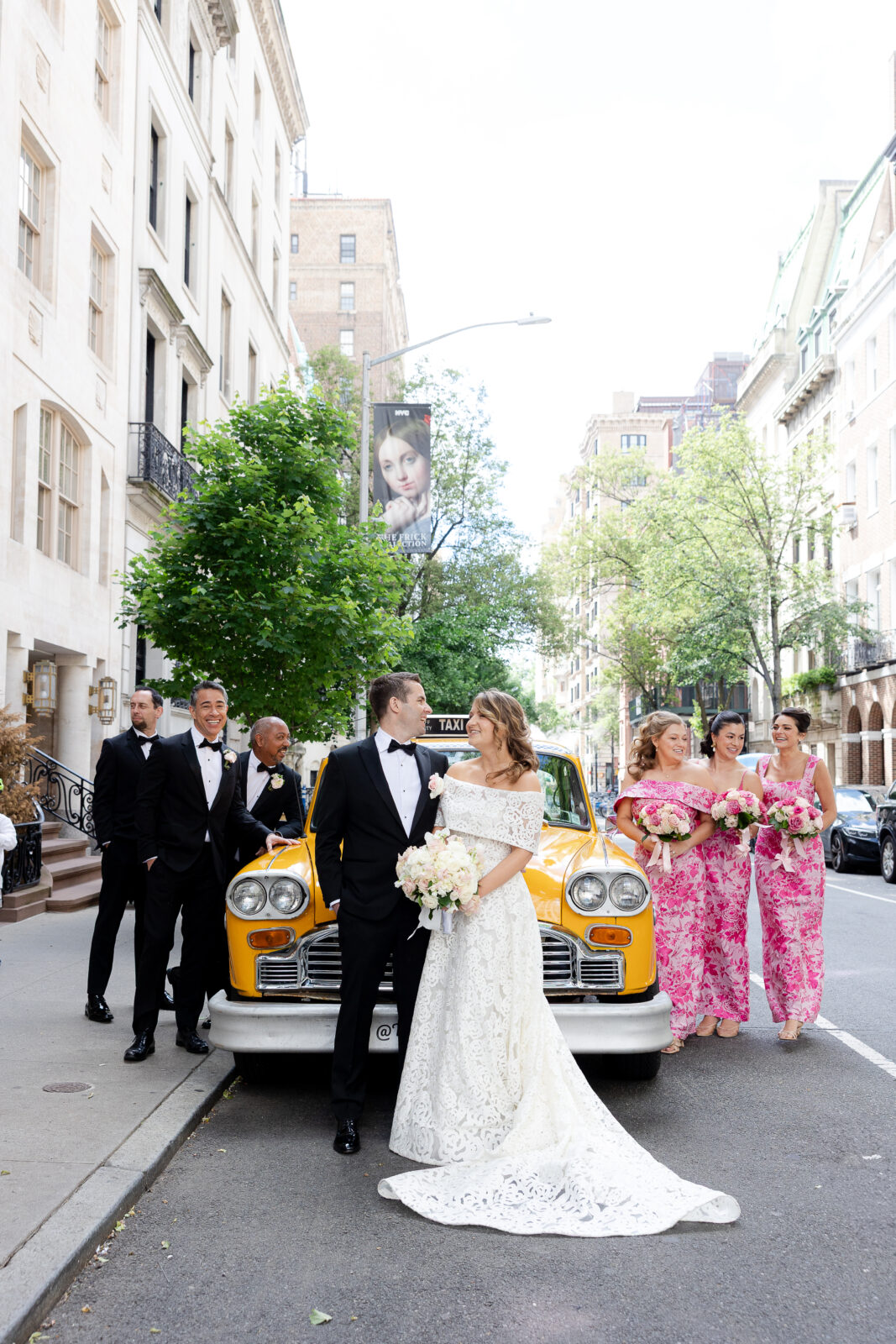 Wedding party in front of checker cab in NYC