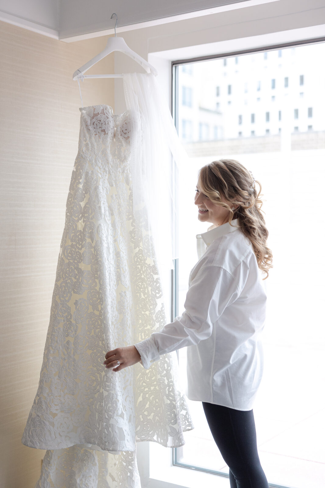 Bride getting ready at NYC Loews Regency Hotel bridal suite