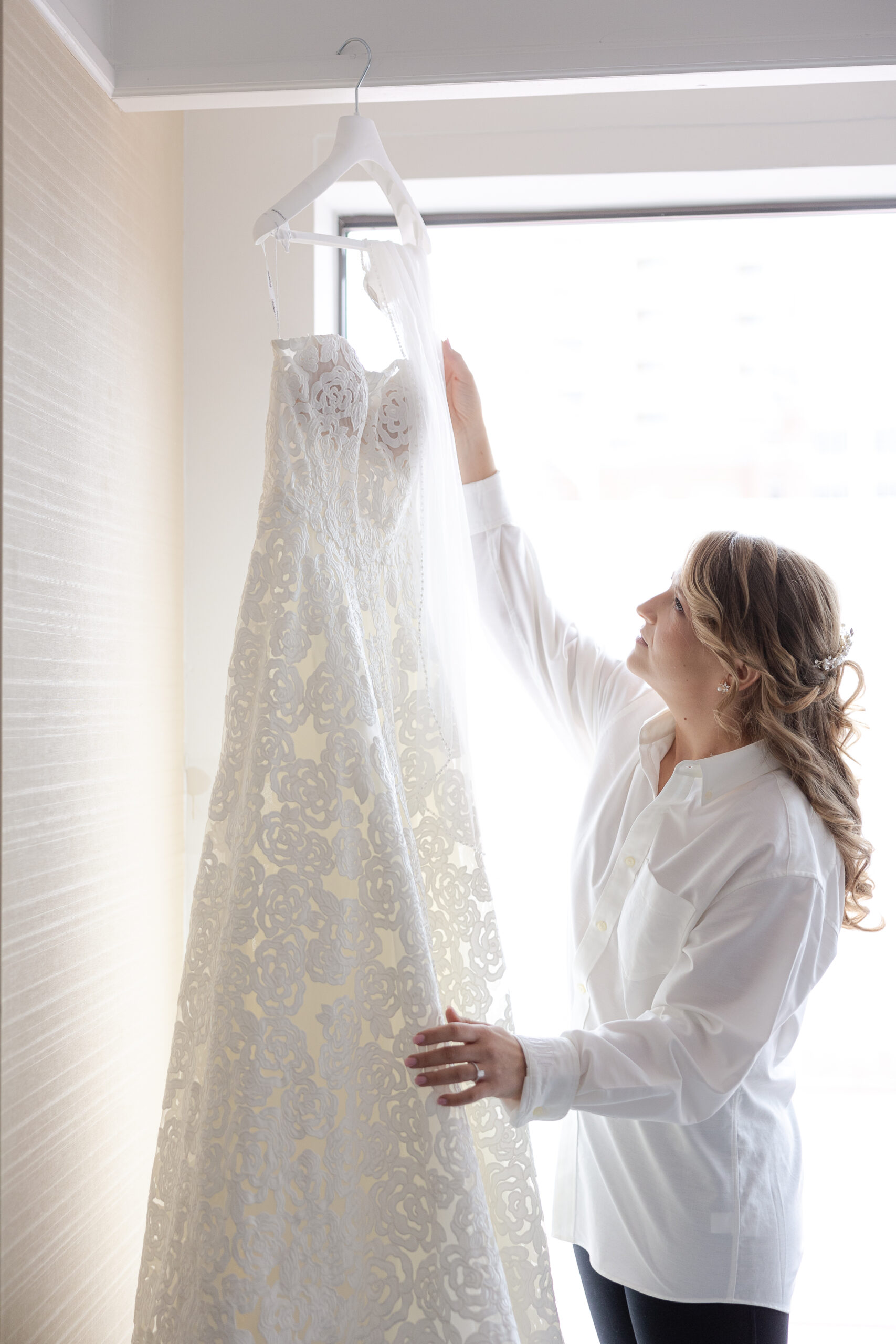 Bride getting ready at NYC Loews Regency Hotel bridal suite