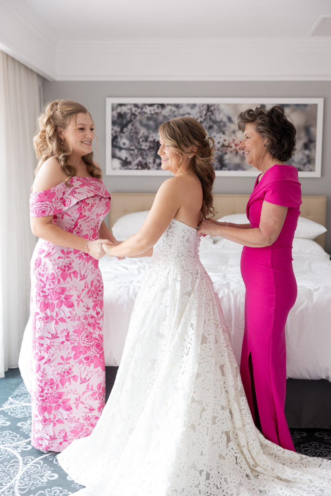 Bride getting dressed at NYC Loews Regency Hotel