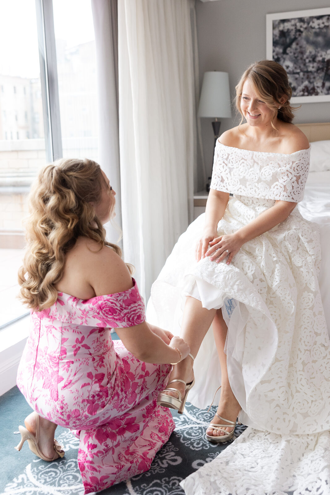 Bride getting dressed at NYC Loews Regency Hotel