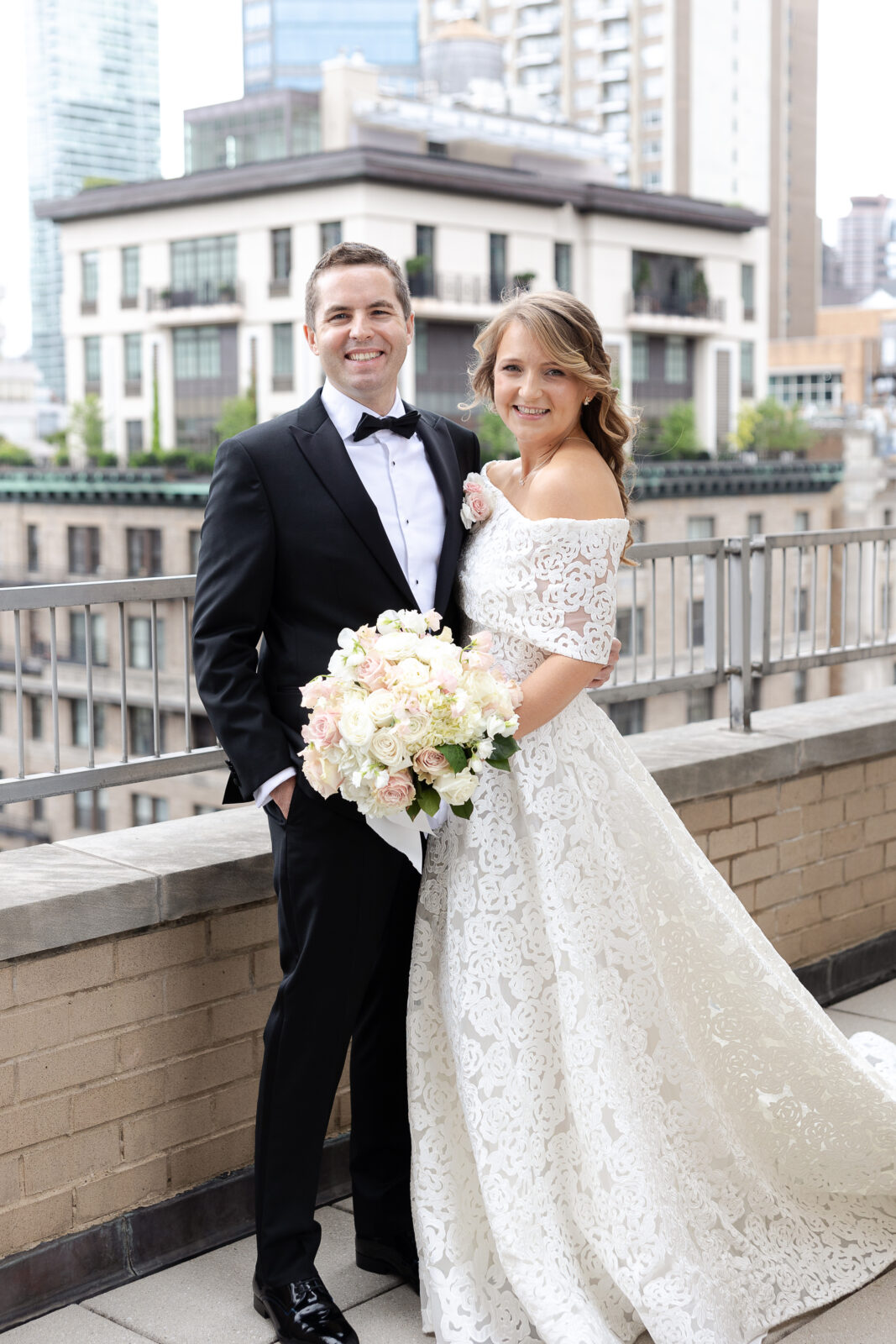 Bride and groom portraits at Loews Regency Hotel balcony