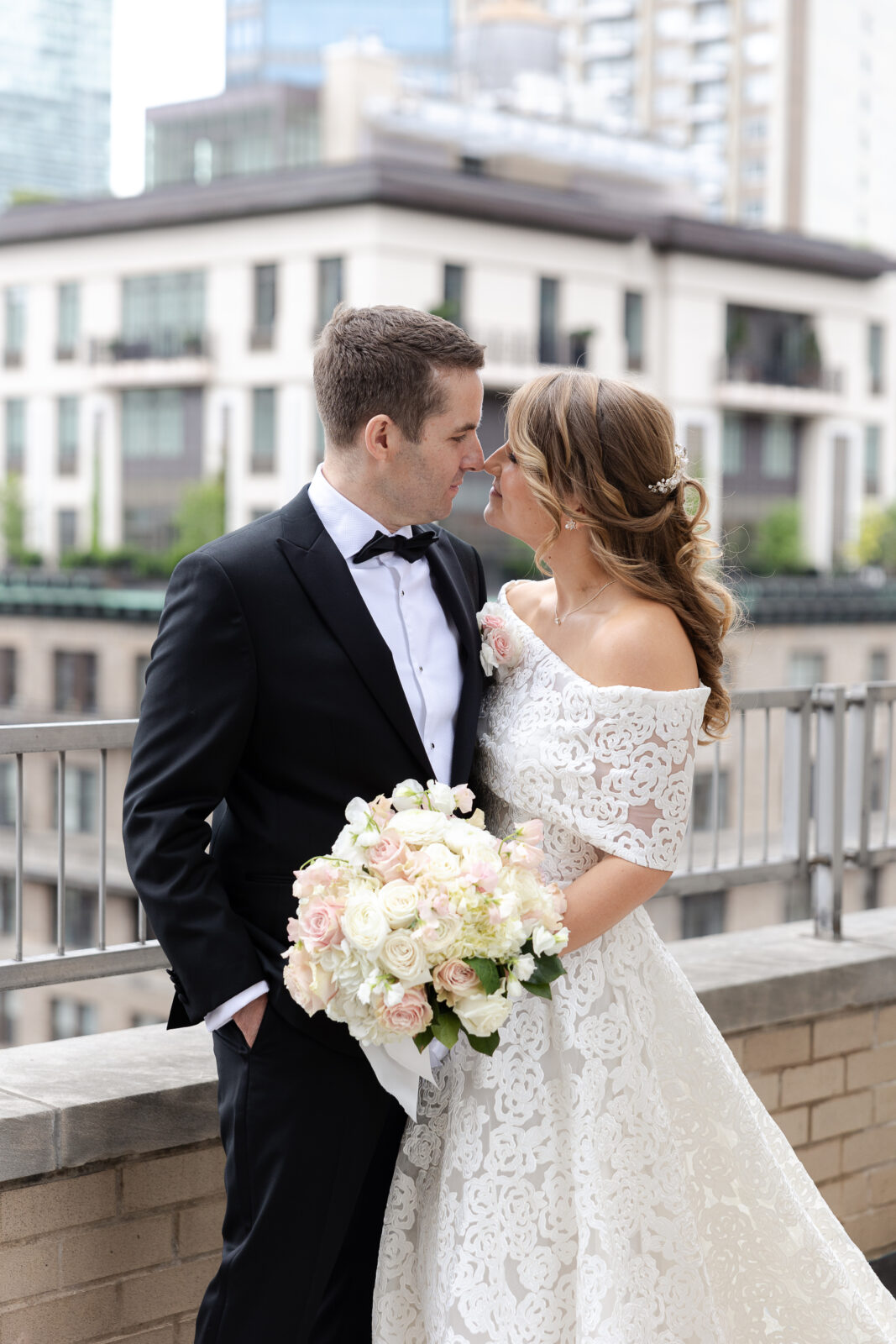 Bride and groom portraits at Loews Regency Hotel balcony