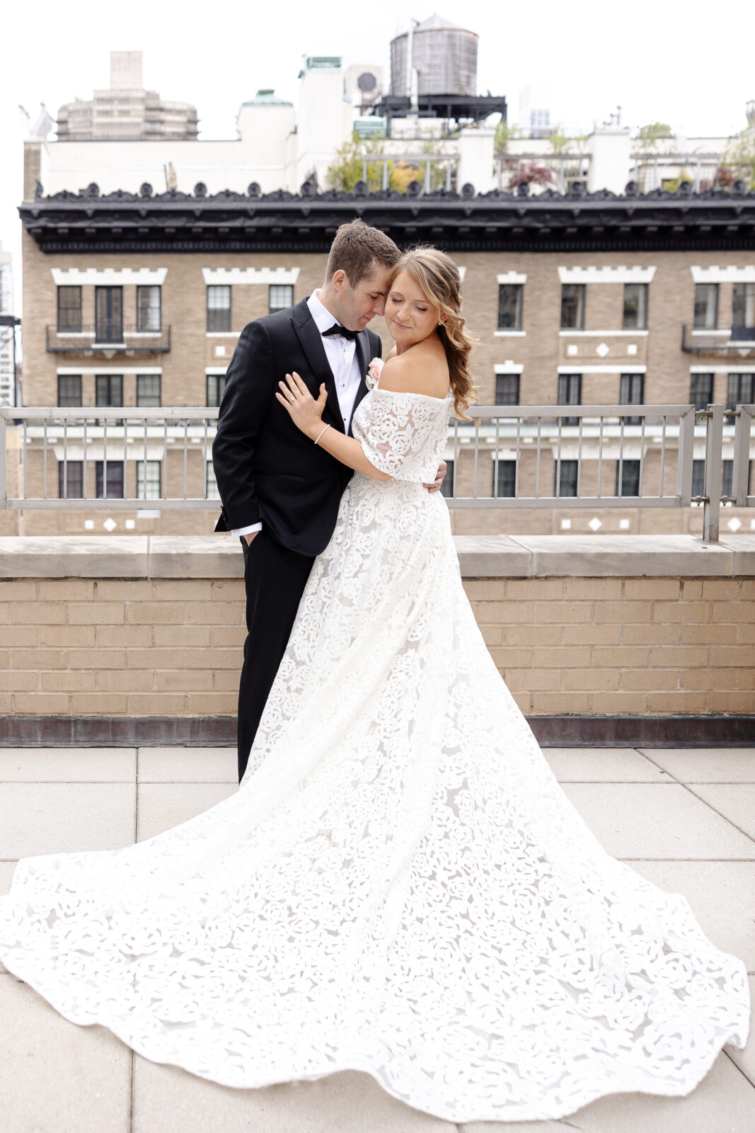 Bride and groom portraits at Loews Regency Hotel balcony