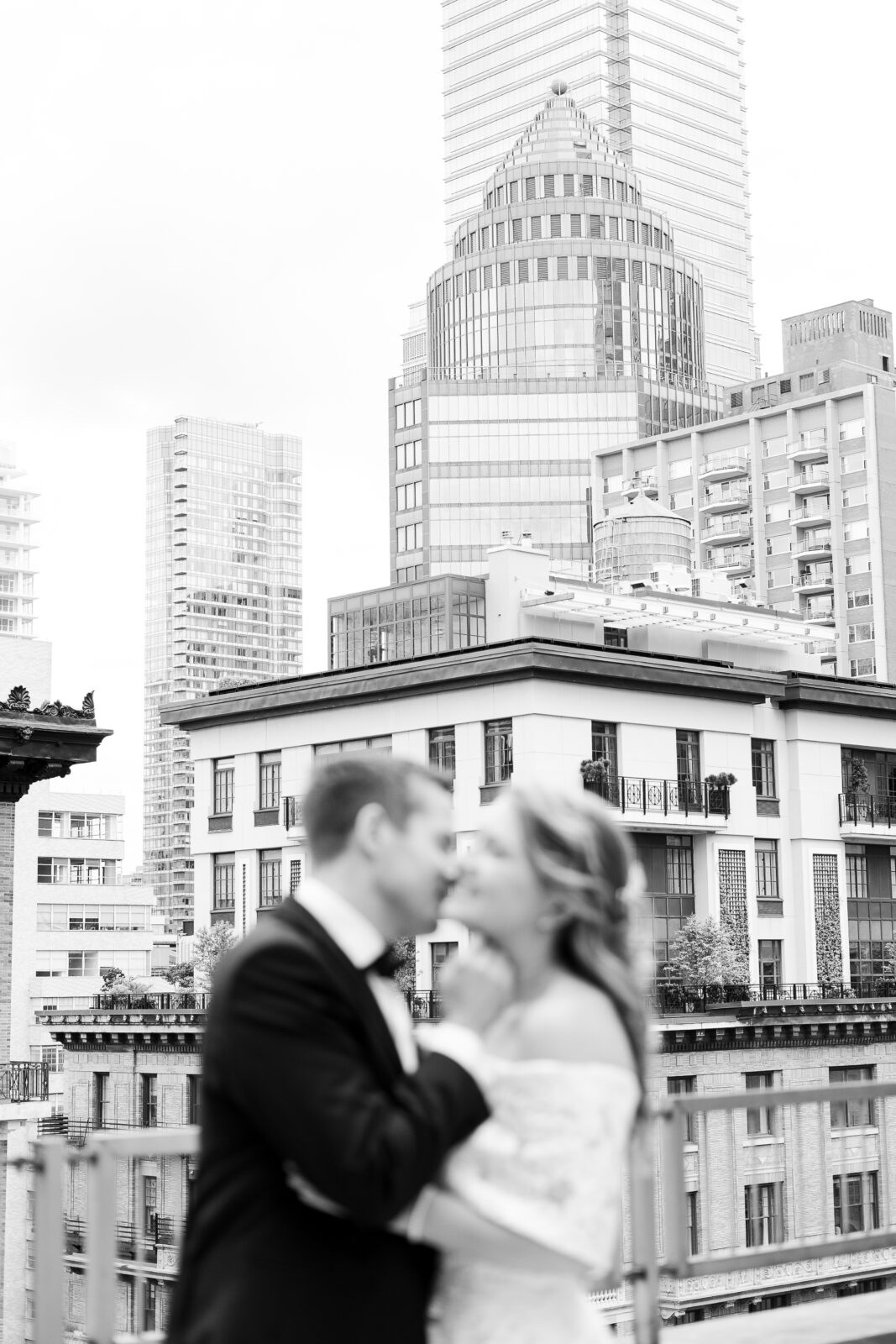 Black and white portraits at Loews Regency Hotel balcony