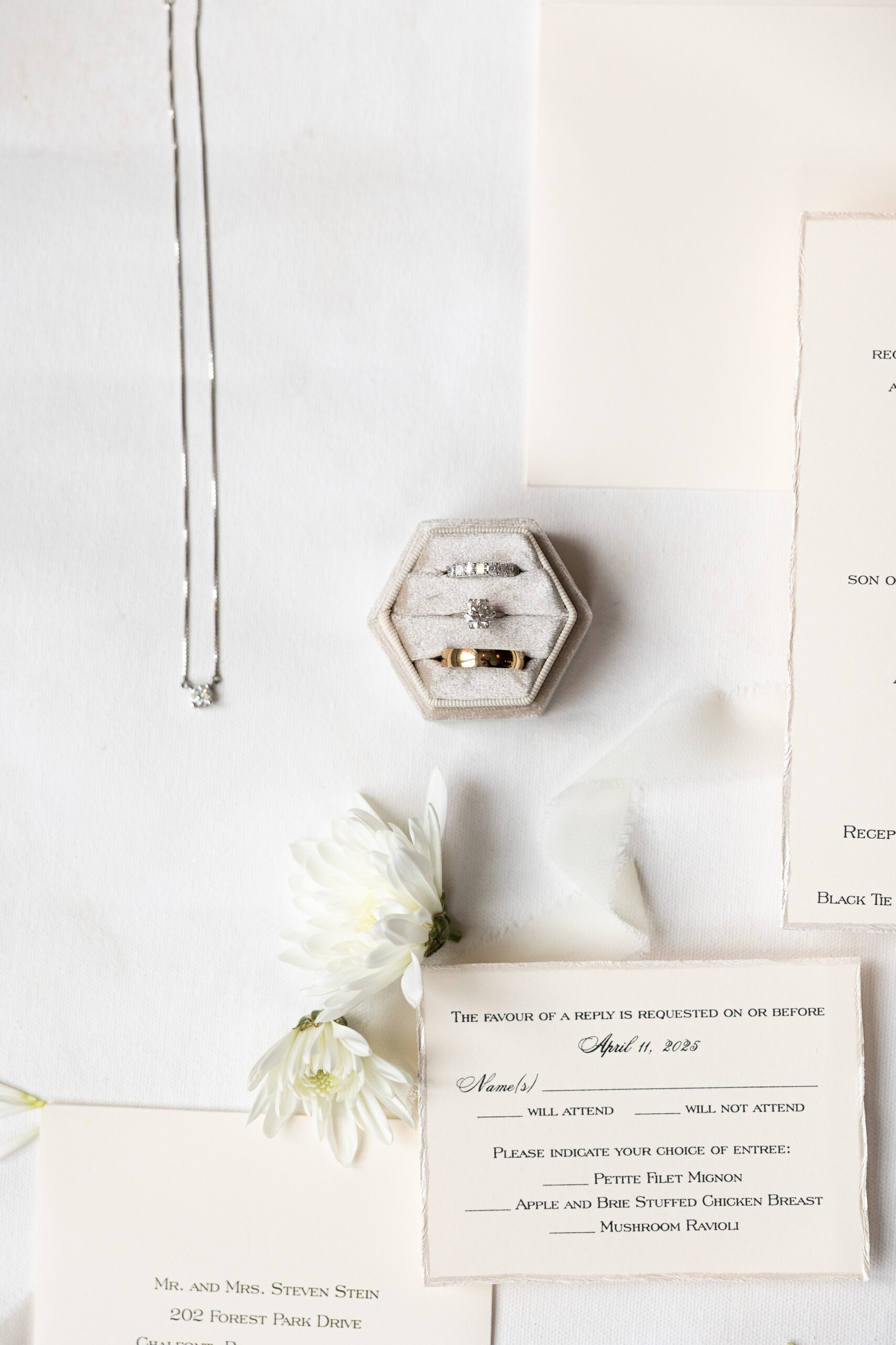 Wedding details with rings and necklace