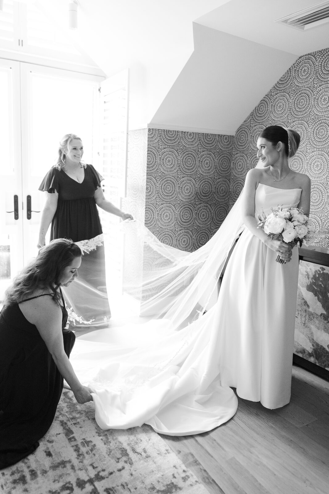 Bride with her bridesmaid at bridal suite
