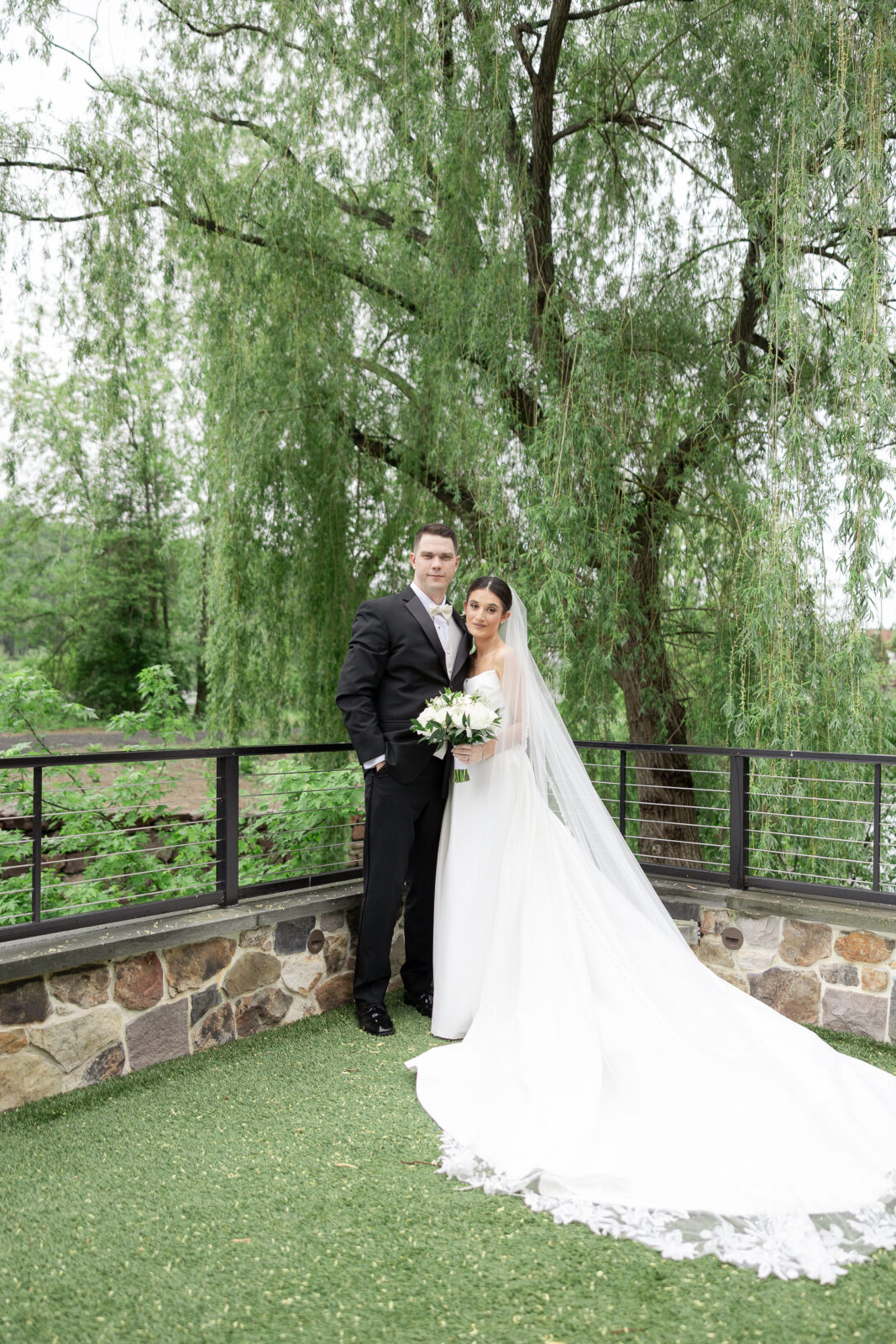 Bride and groom along the Delaware River waterfront